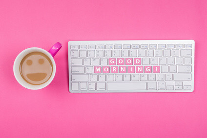 Coffee with smiley face and good morning text